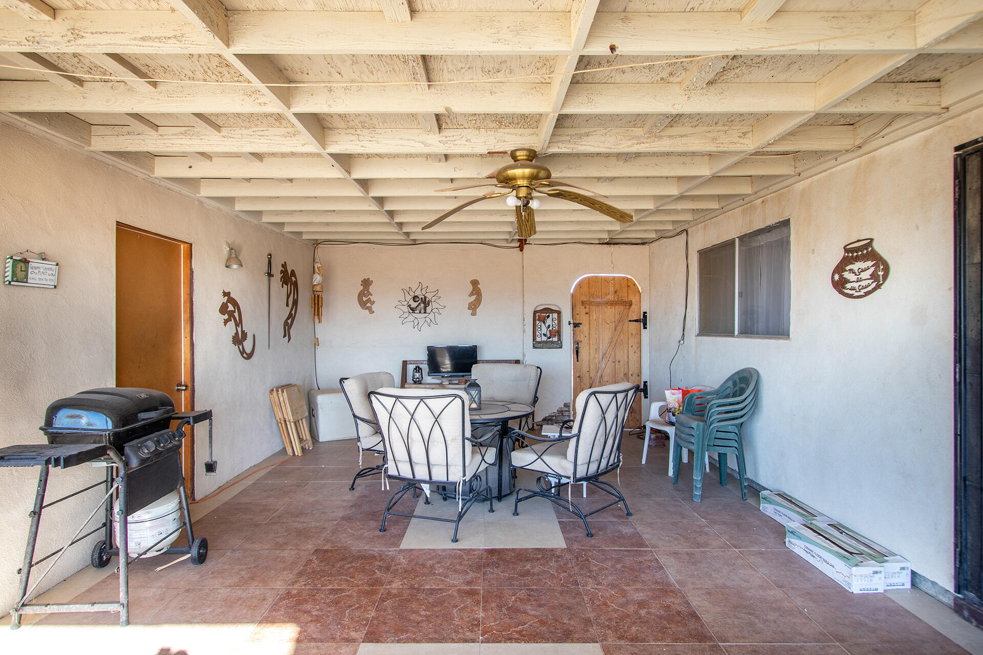 64626 Del Rey Road Joshua Tree, CA 92252 - Photo 23 of 33 a view of a dining room with furniture and chandelier
