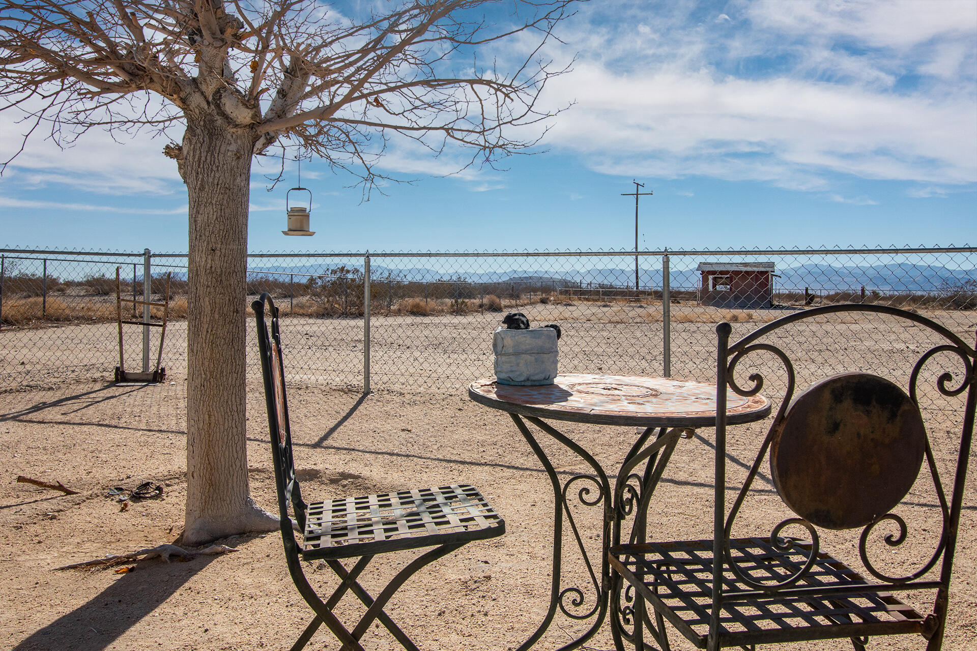 64626 Del Rey Road Joshua Tree, CA 92252 - Photo 3 of 33 a view of a chairs and table in the patio