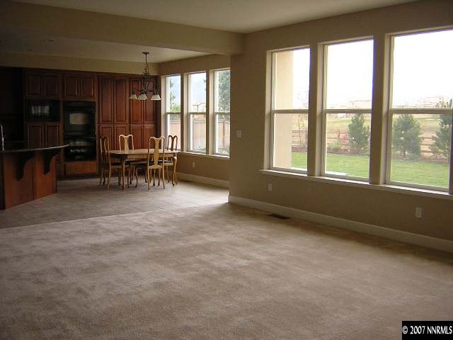 8450 Castlehawk Court Reno, NV 89523 - Photo 2 of 9 an empty room with furniture and a window