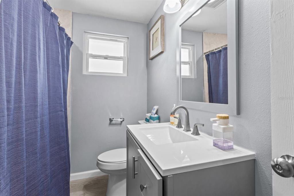 690 Fox Street Longboat Key, FL 34228 - Photo 12 of 41 a bathroom with a toilet sink and mirror