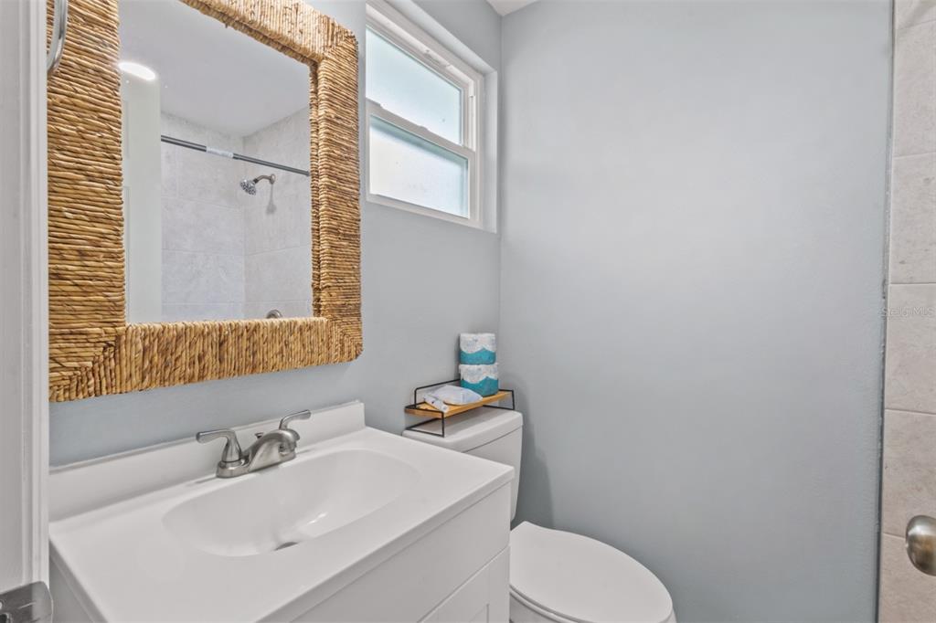 690 Fox Street Longboat Key, FL 34228 - Photo 17 of 41 a bathroom with a sink toilet and a mirror