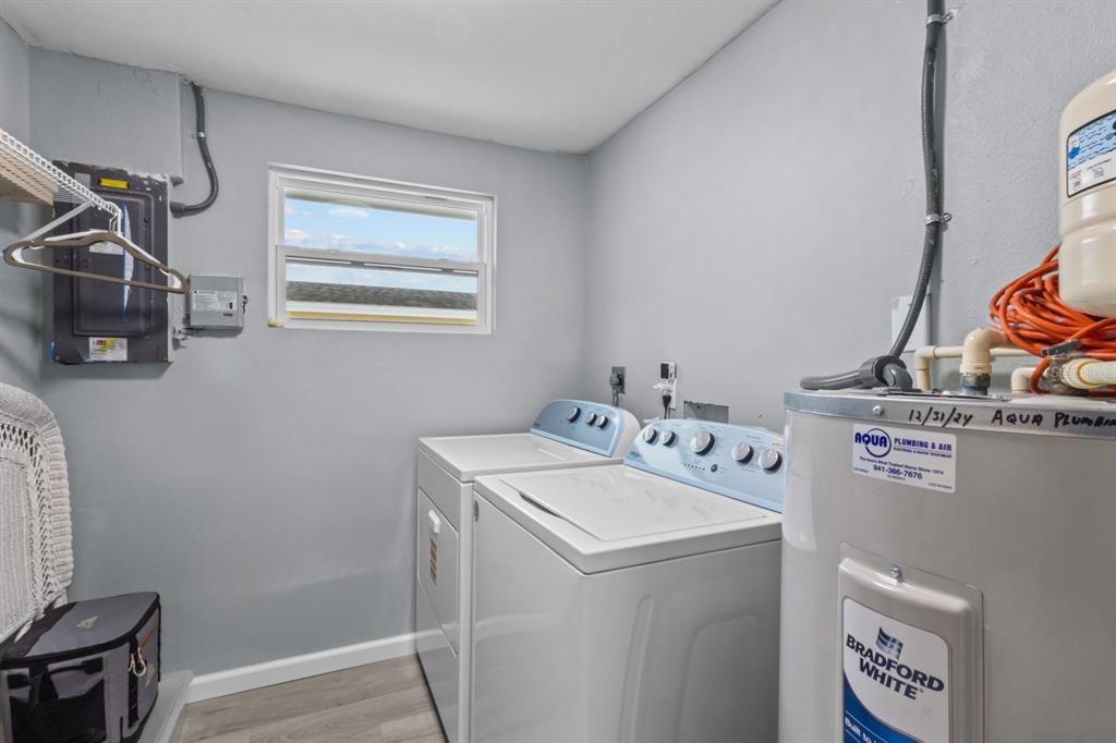 690 Fox Street Longboat Key, FL 34228 - Photo 19 of 41 a utility room with dryer and washer