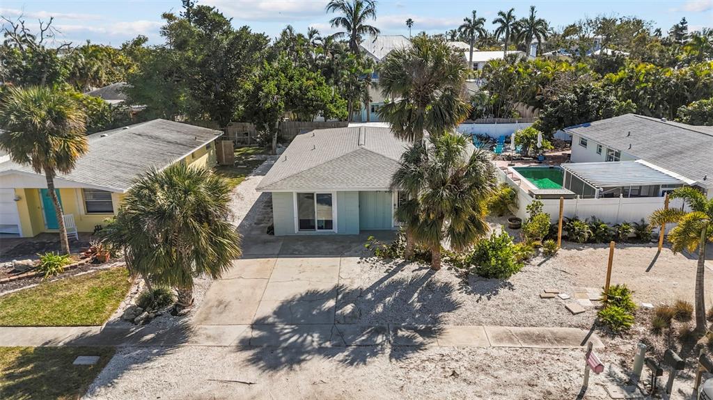 690 Fox Street Longboat Key, FL 34228 - Photo 23 of 41 a view of a house with a yard