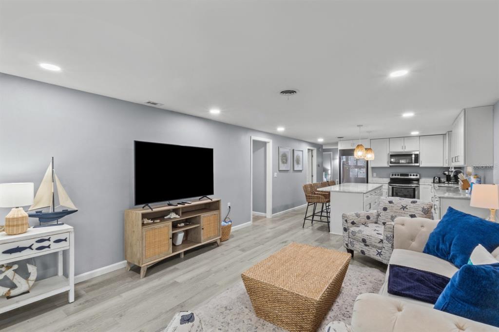 690 Fox Street Longboat Key, FL 34228 - Photo 8 of 41 a living room with furniture and a flat screen tv