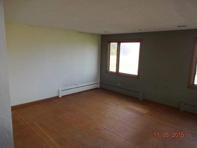 29440 South Klemme Road Beecher, IL 60401 - Photo 3 of 12 an empty room with a window