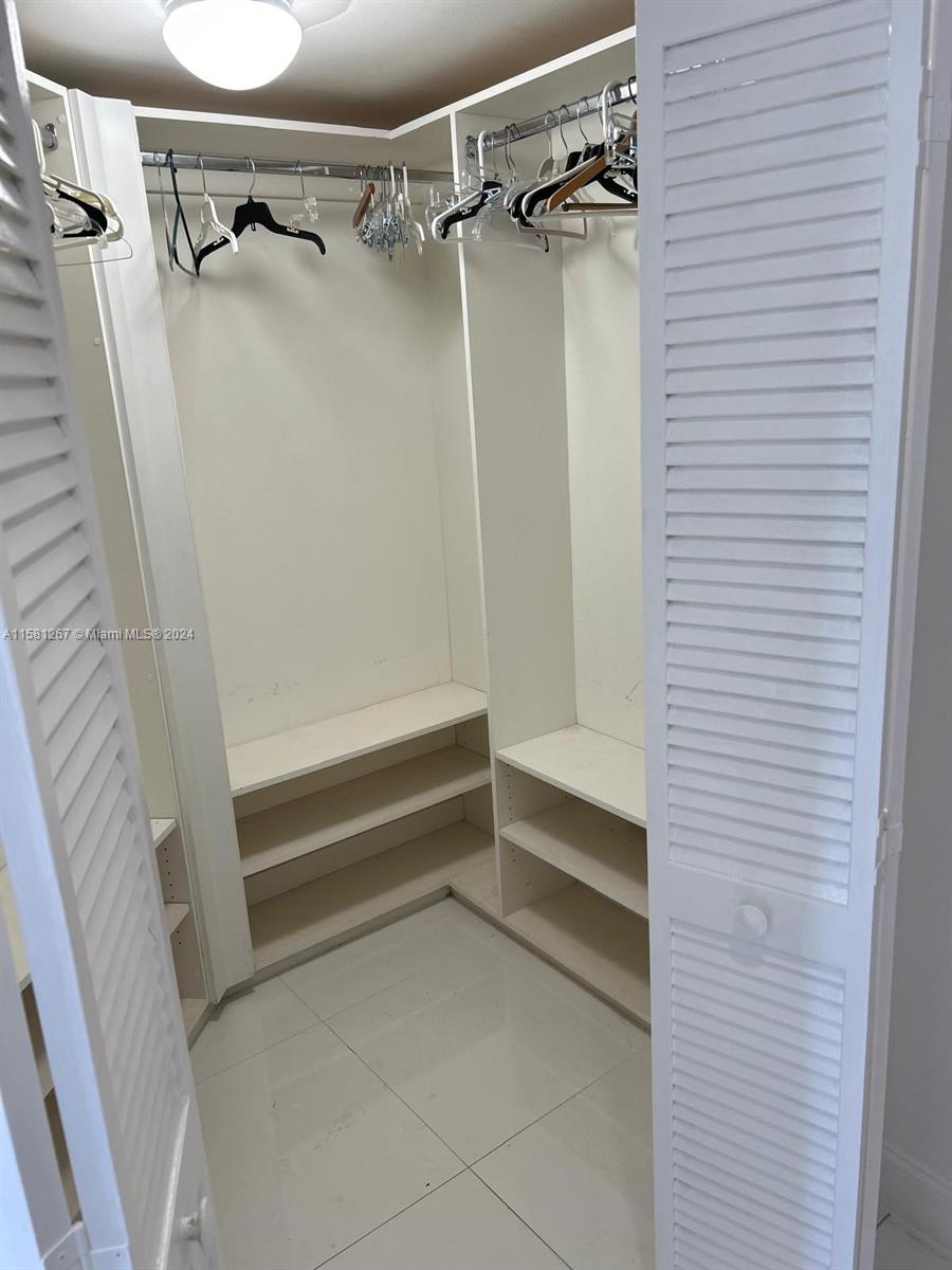 701 Brickell Key Boulevard, Unit 202 Miami, FL 33131 - Photo 13 of 27 a bathroom with a shower and a bathtub