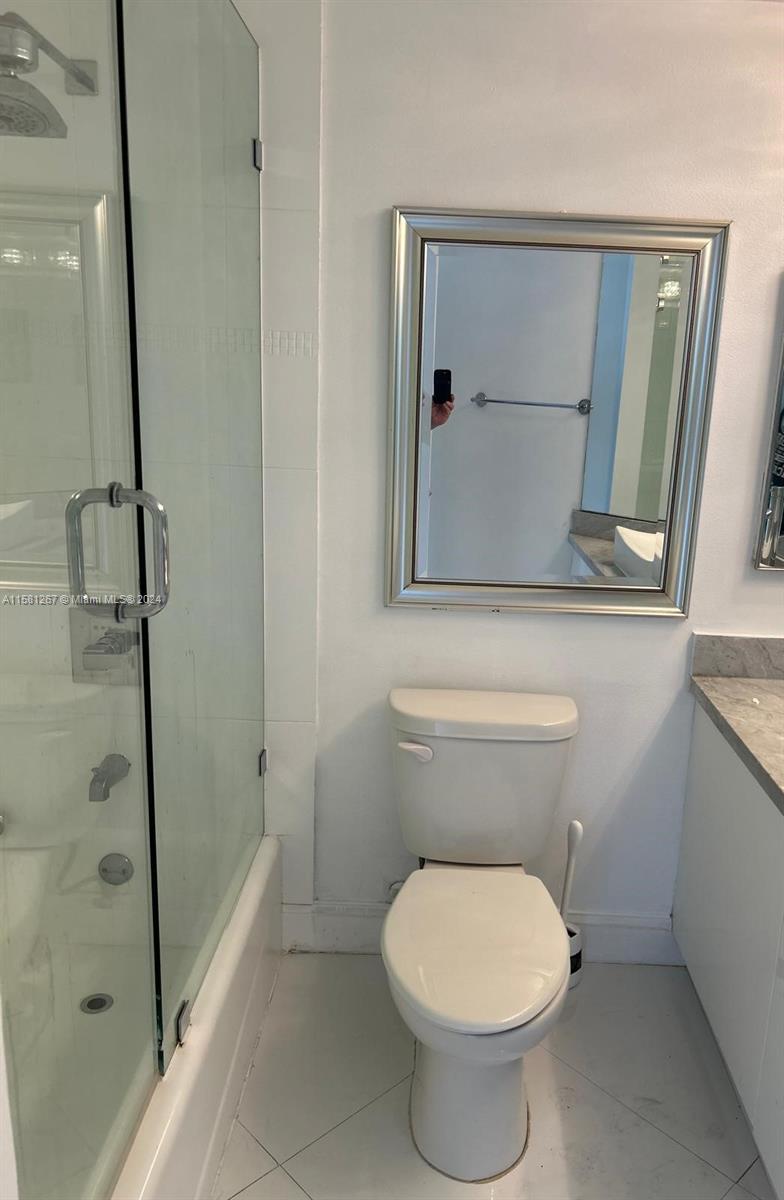 701 Brickell Key Boulevard, Unit 202 Miami, FL 33131 - Photo 17 of 27 a bathroom with a toilet and a shower