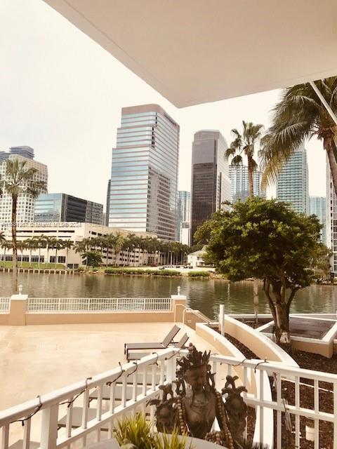 701 Brickell Key Boulevard, Unit 202 Miami, FL 33131 - Photo 8 of 27 a view of swimming pool with outdoor seating and city view