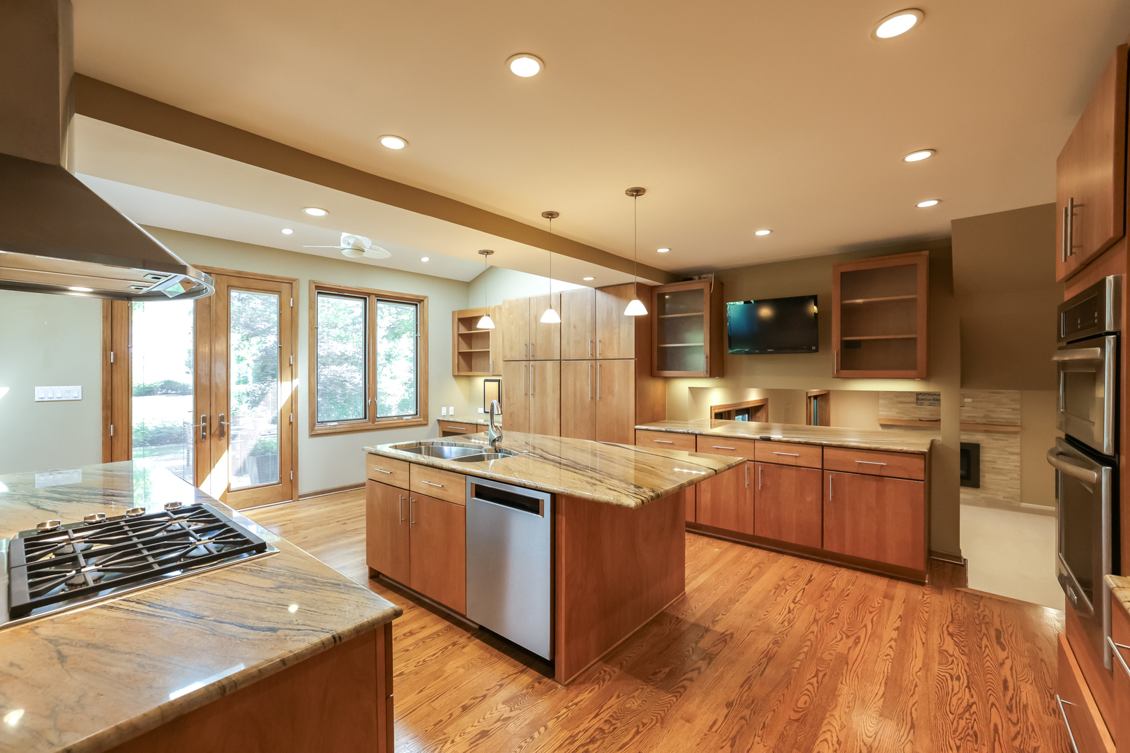 3206 Maple Leaf Drive Glenview, IL 60026 - Photo 11 of 45 a large kitchen with stainless steel appliances granite countertop a stove and cabinets