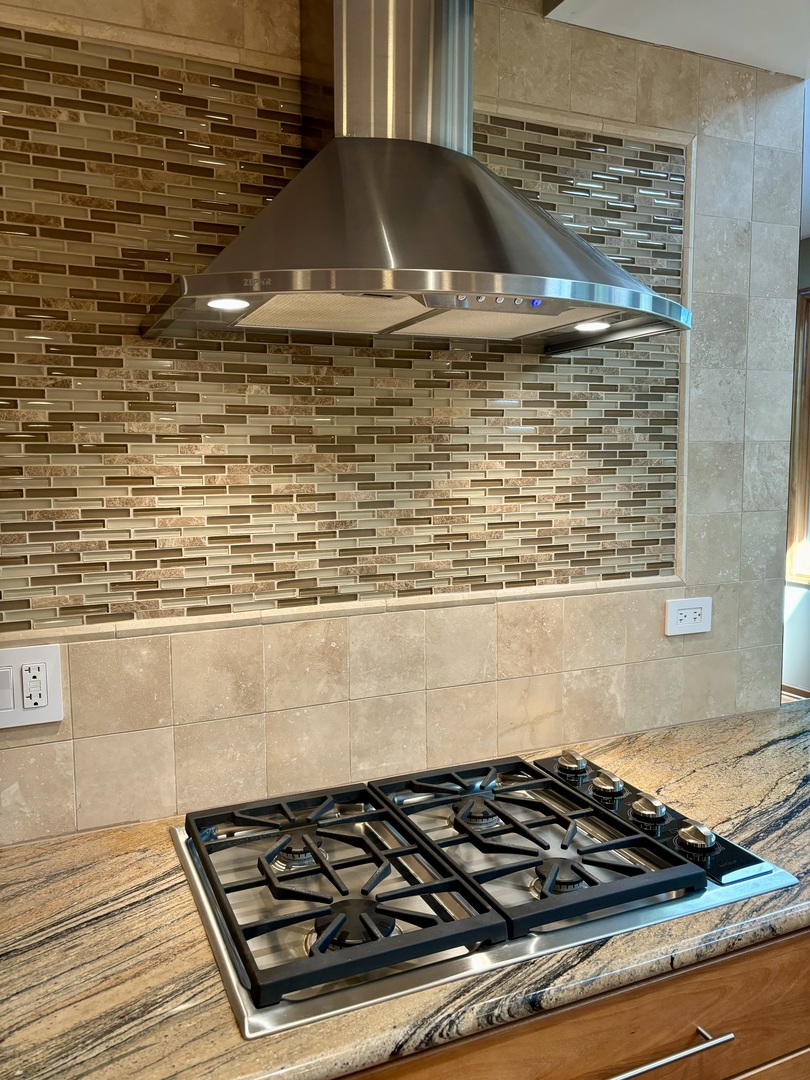 3206 Maple Leaf Drive Glenview, IL 60026 - Photo 12 of 45 a close view of a stove a microwave oven on the counter