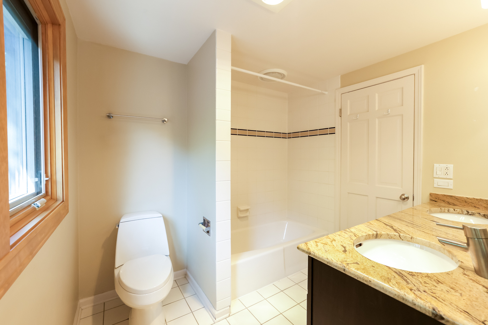 3206 Maple Leaf Drive Glenview, IL 60026 - Photo 24 of 45 a bathroom with a granite countertop sink toilet and shower