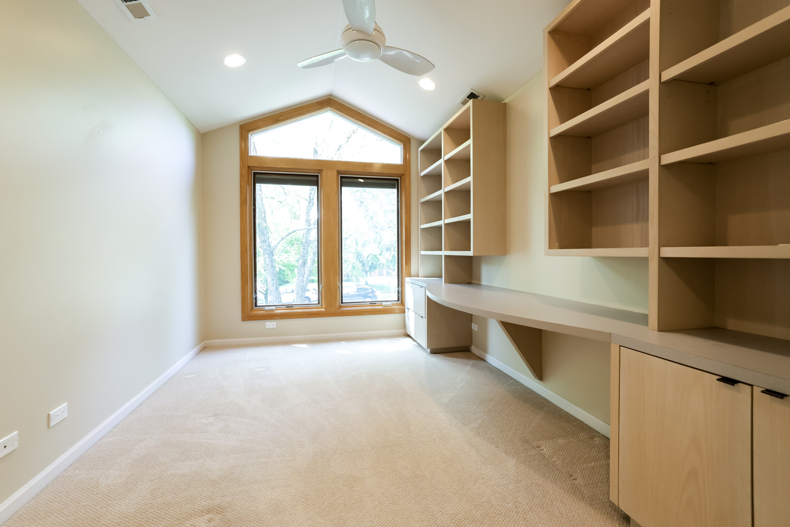 3206 Maple Leaf Drive Glenview, IL 60026 - Photo 30 of 45 a view of an empty room with a window and cabinet