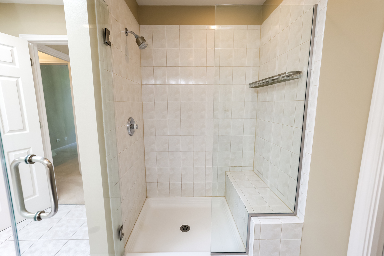 3206 Maple Leaf Drive Glenview, IL 60026 - Photo 33 of 45 a bathroom with a glass shower door