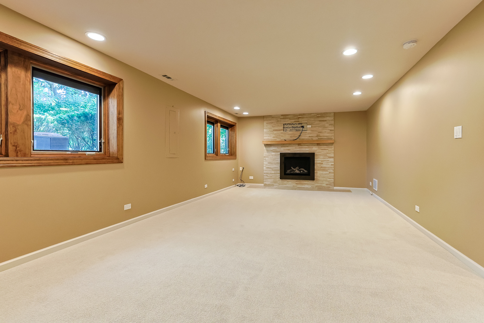 3206 Maple Leaf Drive Glenview, IL 60026 - Photo 37 of 45 an empty room with windows and fireplace