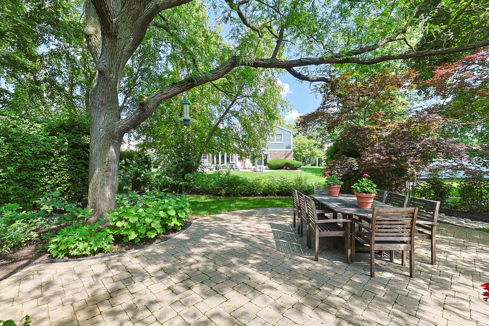 3206 Maple Leaf Drive Glenview, IL 60026 - Photo 42 of 45 a view of a chairs and table in the backyard