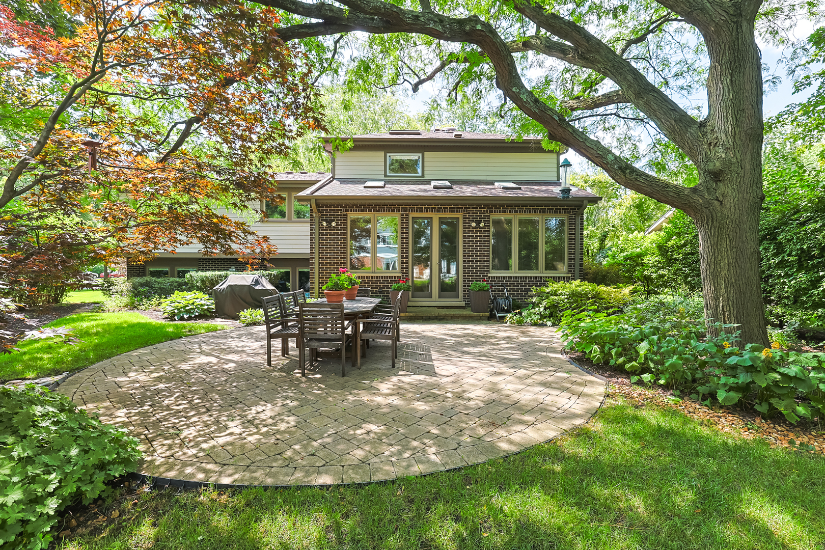 3206 Maple Leaf Drive Glenview, IL 60026 - Photo 43 of 45 a view of a house with backyard sitting area and garden