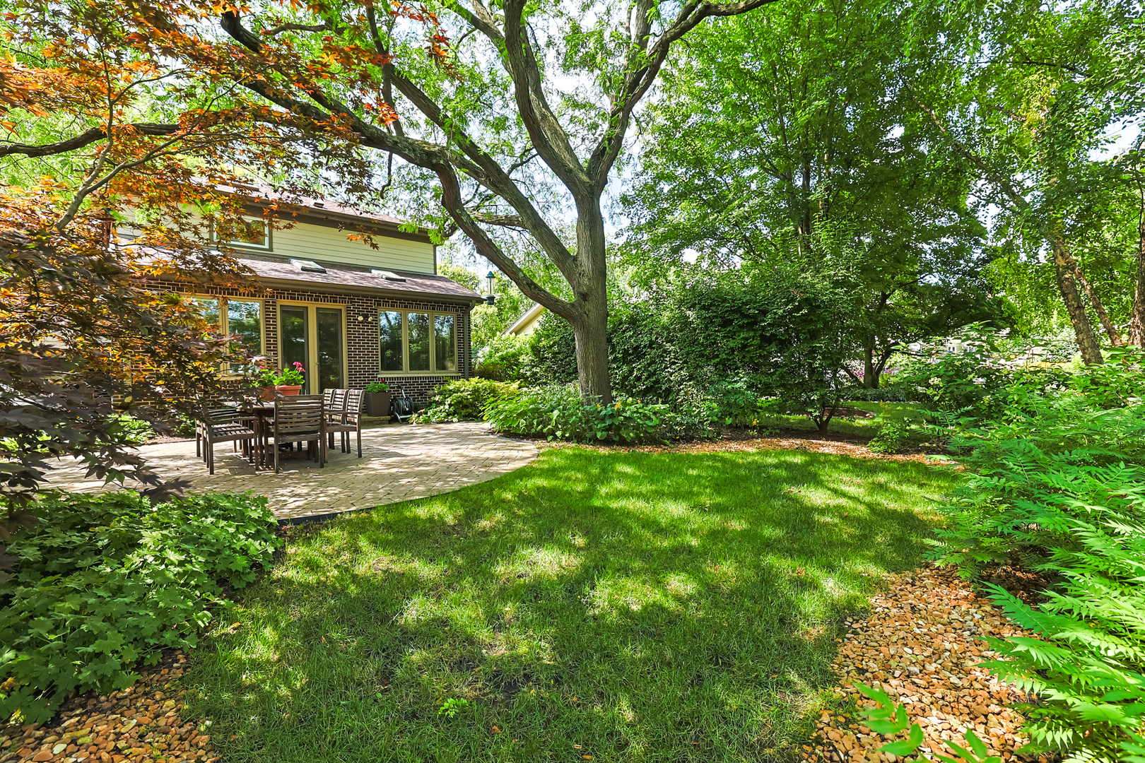 3206 Maple Leaf Drive Glenview, IL 60026 - Photo 44 of 45 a view of a patio with couches and a big yard