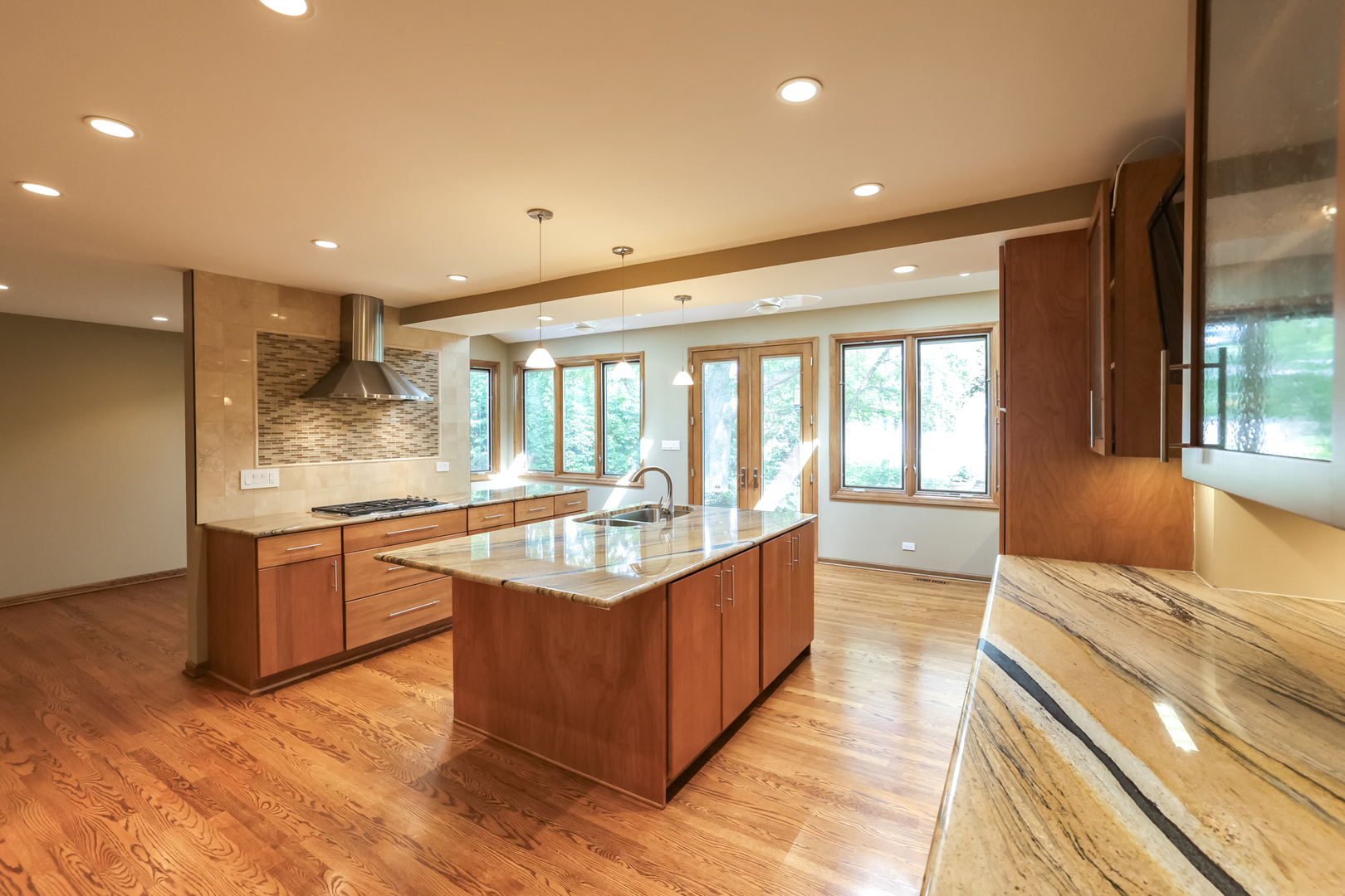 3206 Maple Leaf Drive Glenview, IL 60026 - Photo 6 of 45 a large kitchen with granite countertop a large counter top and stainless steel appliances