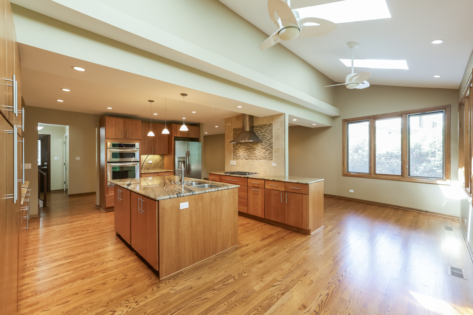 3206 Maple Leaf Drive Glenview, IL 60026 - Photo 10 of 45 a large kitchen with stainless steel appliances granite countertop a large counter top and a wooden floors