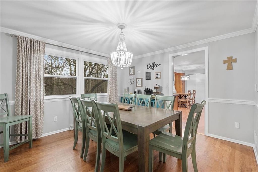 9350 Timber Trail Pittsburgh, PA 15237 - Photo 12 of 38 a dining room with furniture a chandelier and wooden floor