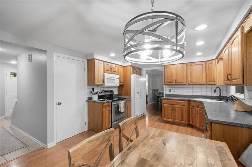 9350 Timber Trail Pittsburgh, PA 15237 - Photo 15 of 38 a kitchen with stainless steel appliances granite countertop a stove a refrigerator and a sink