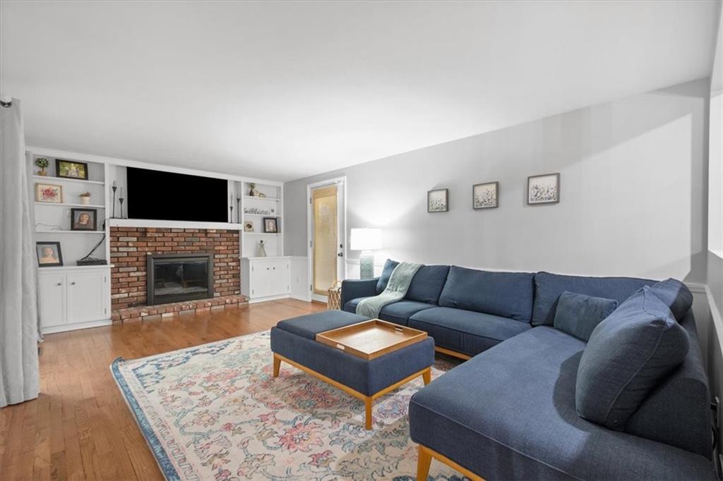 9350 Timber Trail Pittsburgh, PA 15237 - Photo 19 of 38 a living room with furniture a flat screen tv and a fireplace