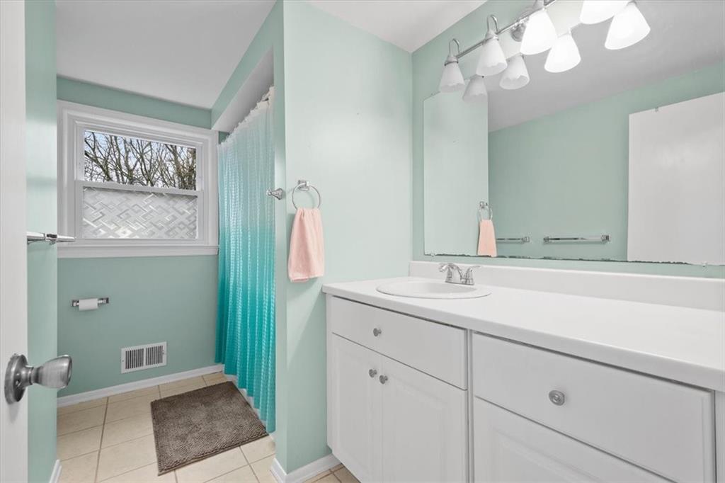 9350 Timber Trail Pittsburgh, PA 15237 - Photo 29 of 38 a bathroom with a sink a toilet and a mirror