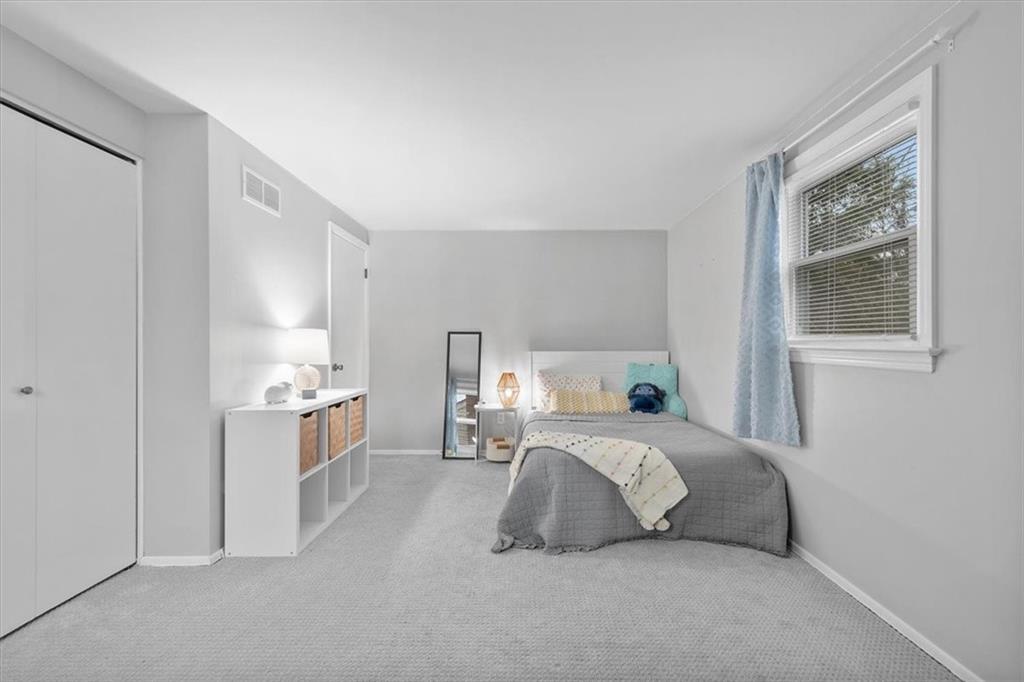 9350 Timber Trail Pittsburgh, PA 15237 - Photo 31 of 38 a bedroom with a bed and a night stand