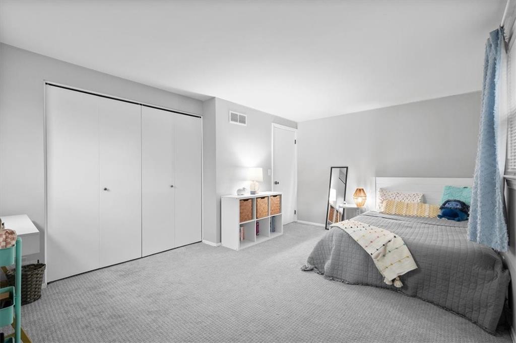 9350 Timber Trail Pittsburgh, PA 15237 - Photo 32 of 38 a bedroom with a large bed and a chandelier