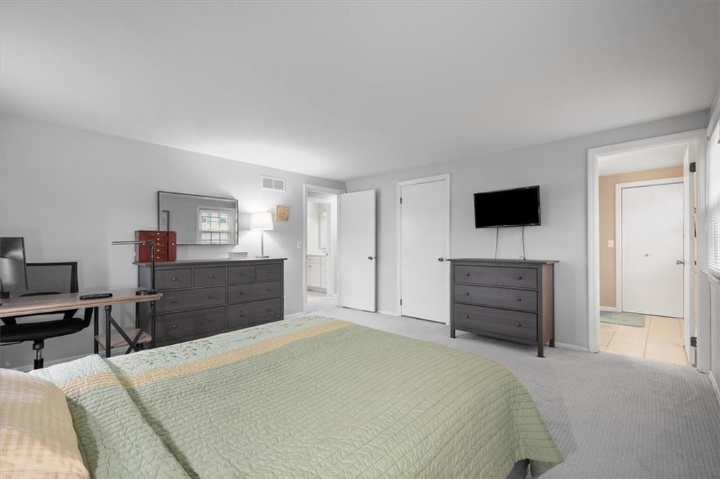 9350 Timber Trail Pittsburgh, PA 15237 - Photo 37 of 38 a bedroom with a bed and a flat screen tv