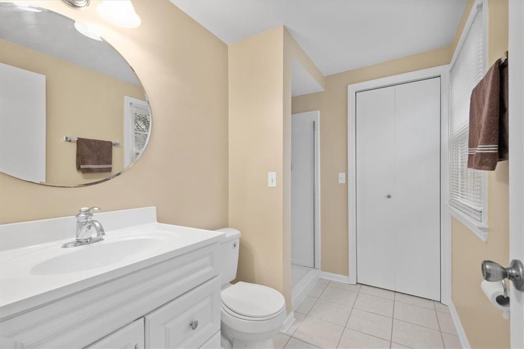 9350 Timber Trail Pittsburgh, PA 15237 - Photo 38 of 38 a bathroom with a sink a toilet a mirror and shower