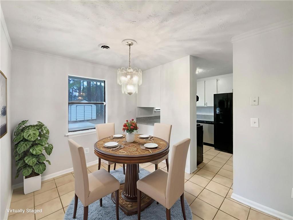 445 Wilson Mill Road Southwest Atlanta, GA 30331 - Photo 11 of 23 a view of a dining room with furniture and chandelier