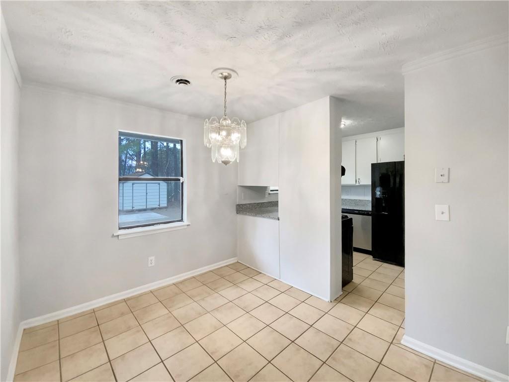 445 Wilson Mill Road Southwest Atlanta, GA 30331 - Photo 12 of 23 a view of a room with a chandelier fan and windows