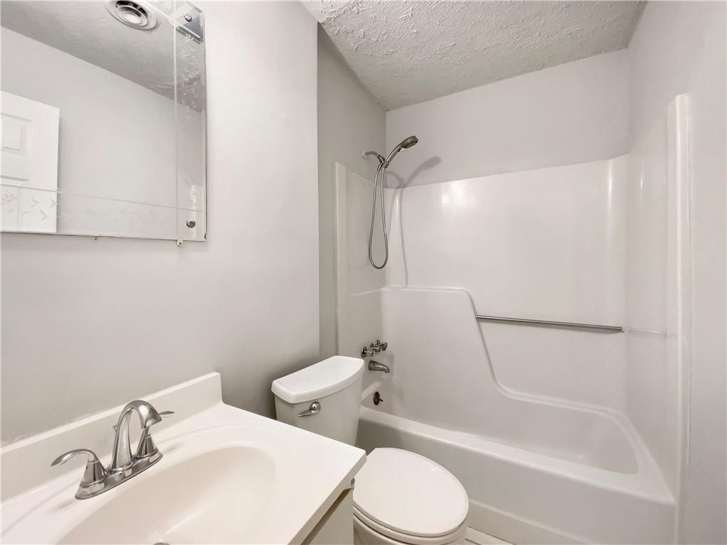 445 Wilson Mill Road Southwest Atlanta, GA 30331 - Photo 20 of 23 a bathroom with a sink toilet and shower