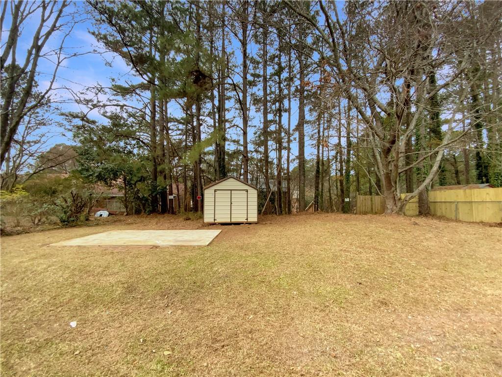 445 Wilson Mill Road Southwest Atlanta, GA 30331 - Photo 22 of 23 a house with trees in front of it