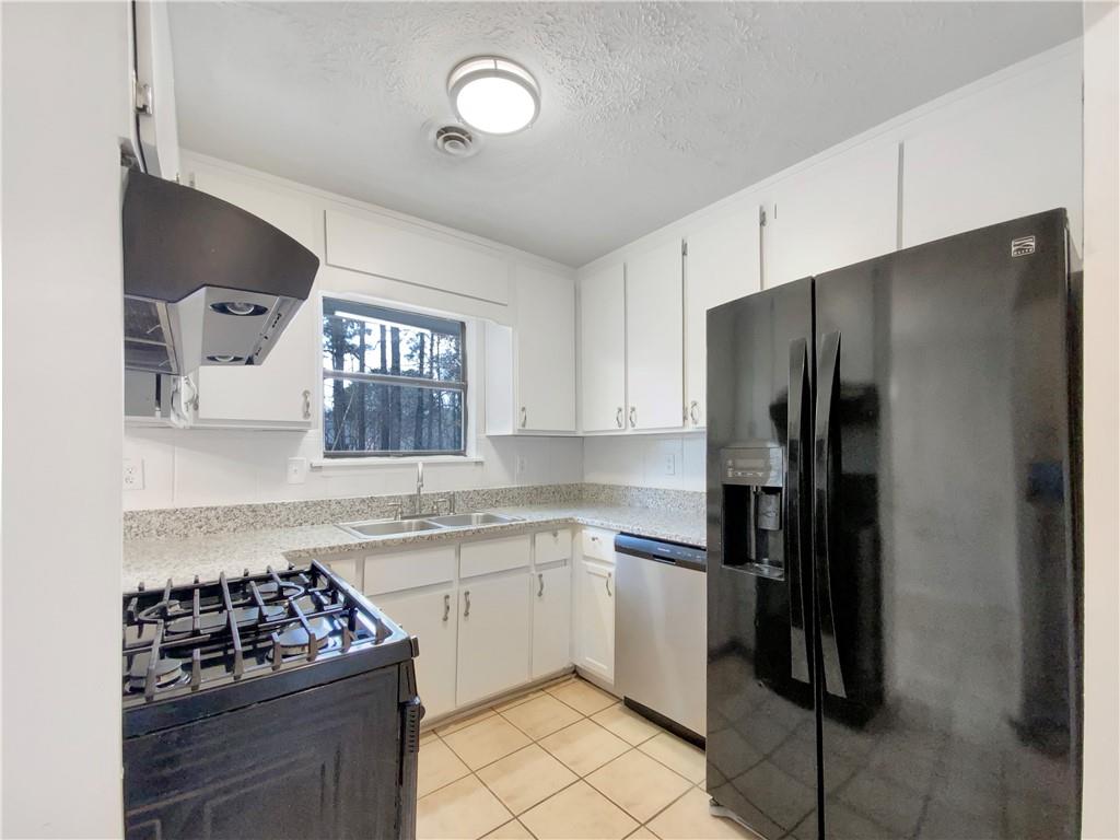 445 Wilson Mill Road Southwest Atlanta, GA 30331 - Photo 8 of 23 a kitchen with a sink stove and refrigerator