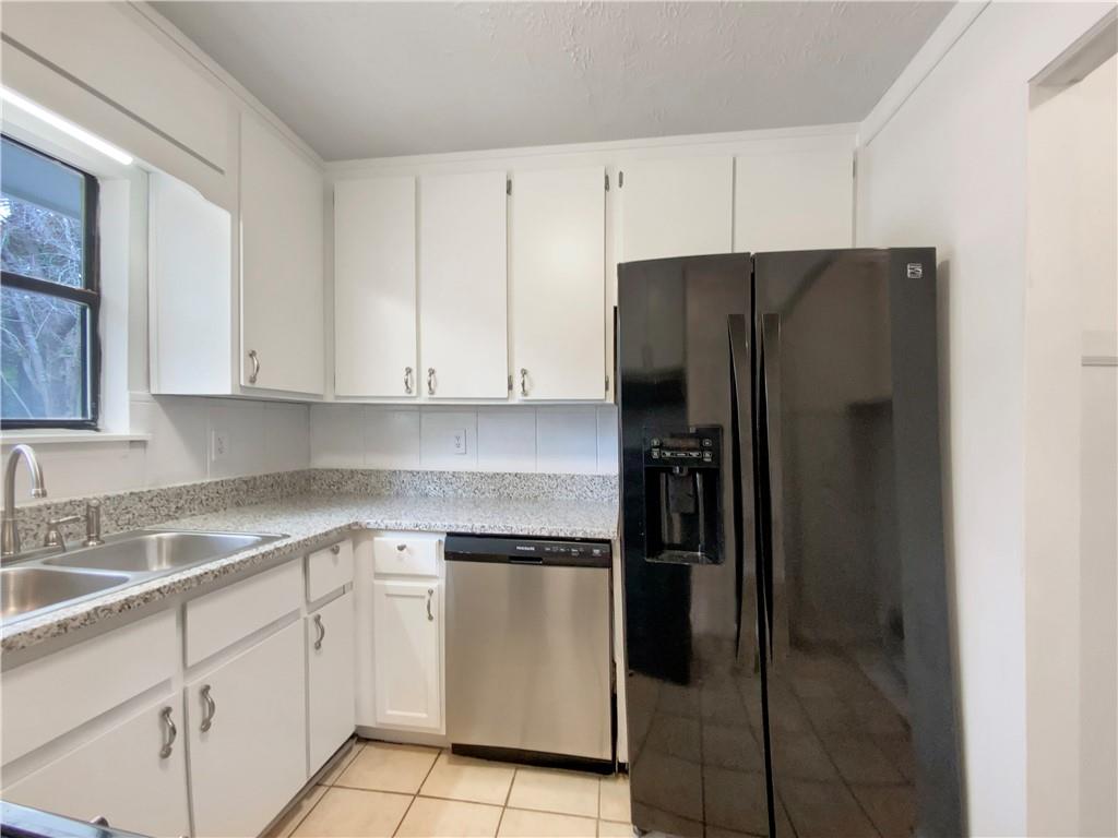445 Wilson Mill Road Southwest Atlanta, GA 30331 - Photo 10 of 23 a kitchen with white cabinets and refrigerator