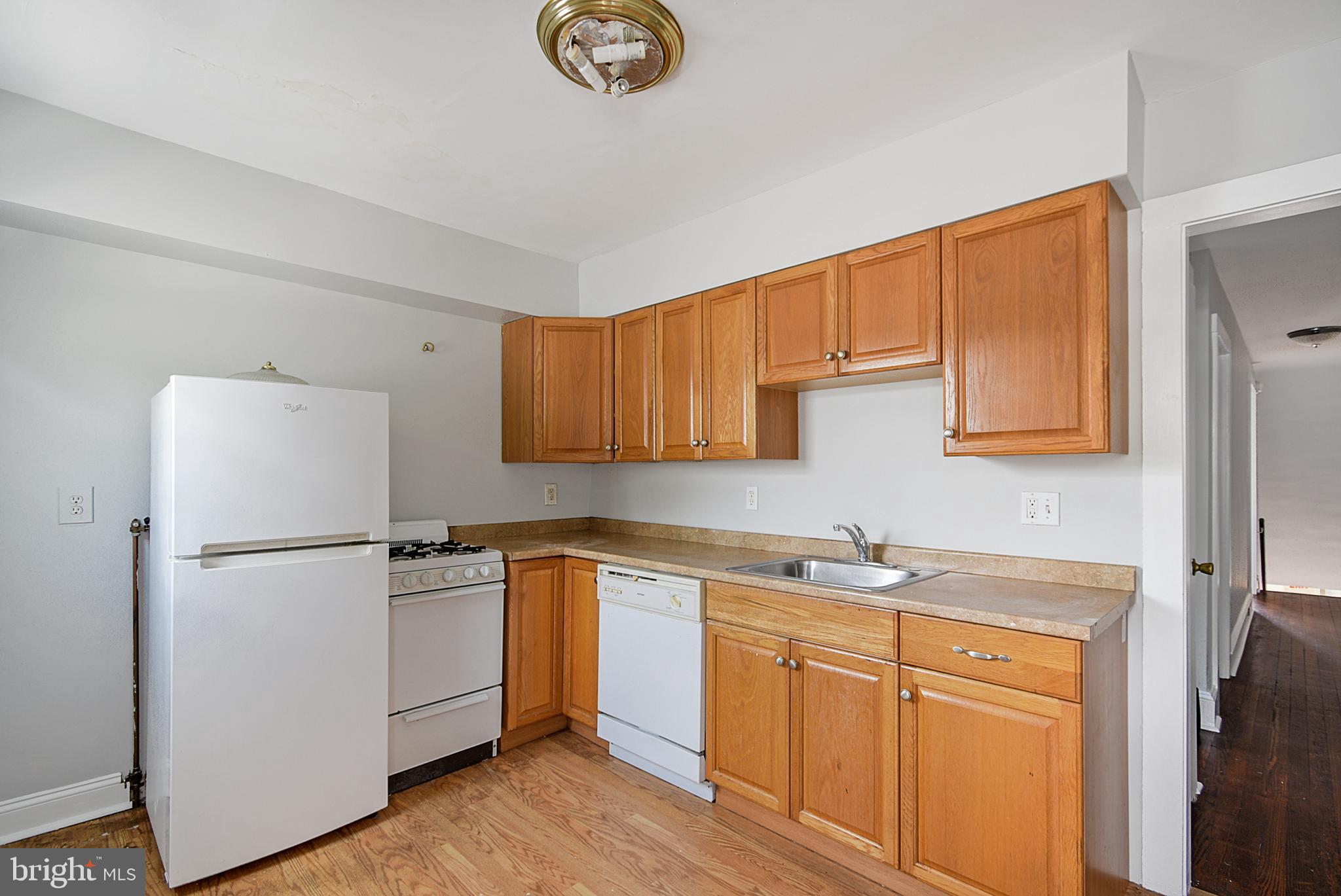 2411 West Darby Road Havertown, PA 19083 - Photo 1 of 8 a kitchen with stainless steel appliances granite countertop a refrigerator sink and cabinets
