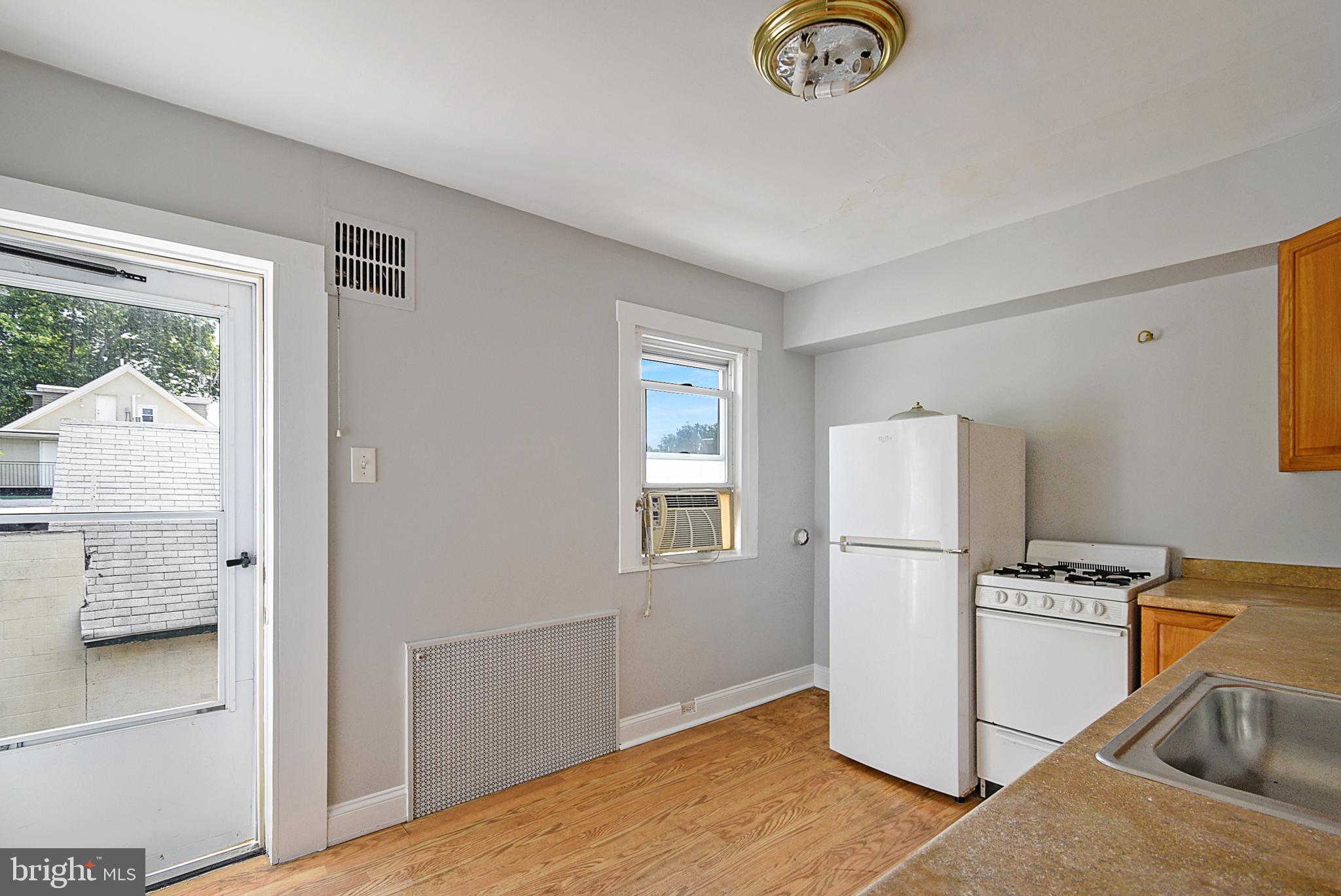 2411 West Darby Road Havertown, PA 19083 - Photo 2 of 8 a kitchen with stainless steel appliances a refrigerator sink and cabinets