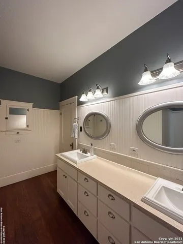 a view of an empty room and wooden floor