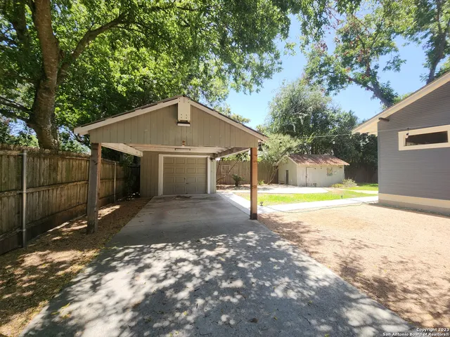 a backyard of a house with lots of green space