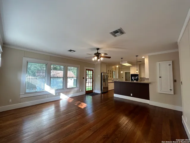a kitchen with refrigerator and microwave