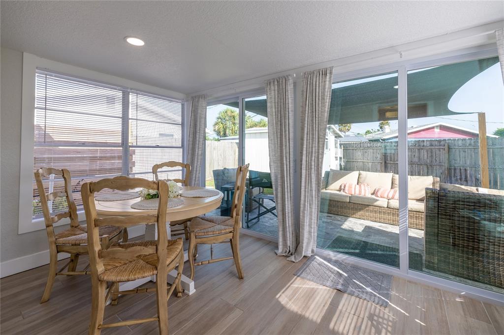 54 Rivershore Drive Ormond Beach, FL 32176 - Photo 12 of 38 a view of a dining room with furniture window and wooden floor