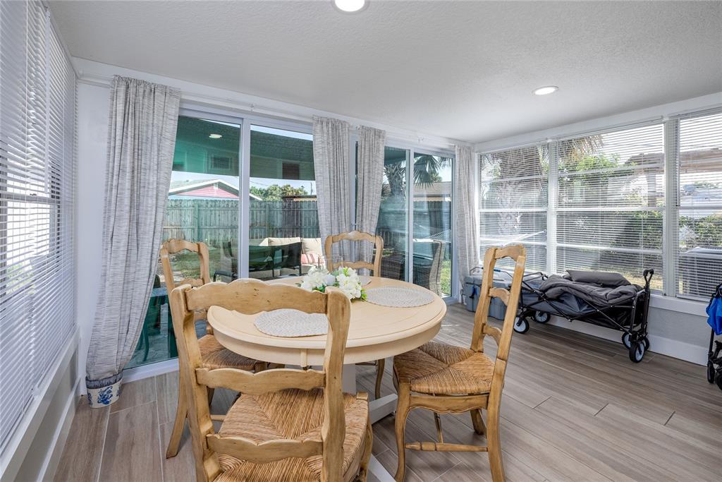 54 Rivershore Drive Ormond Beach, FL 32176 - Photo 14 of 38 a dining room with furniture window and wooden floor