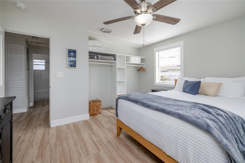 54 Rivershore Drive Ormond Beach, FL 32176 - Photo 17 of 38 a bedroom with a bed and a chandelier