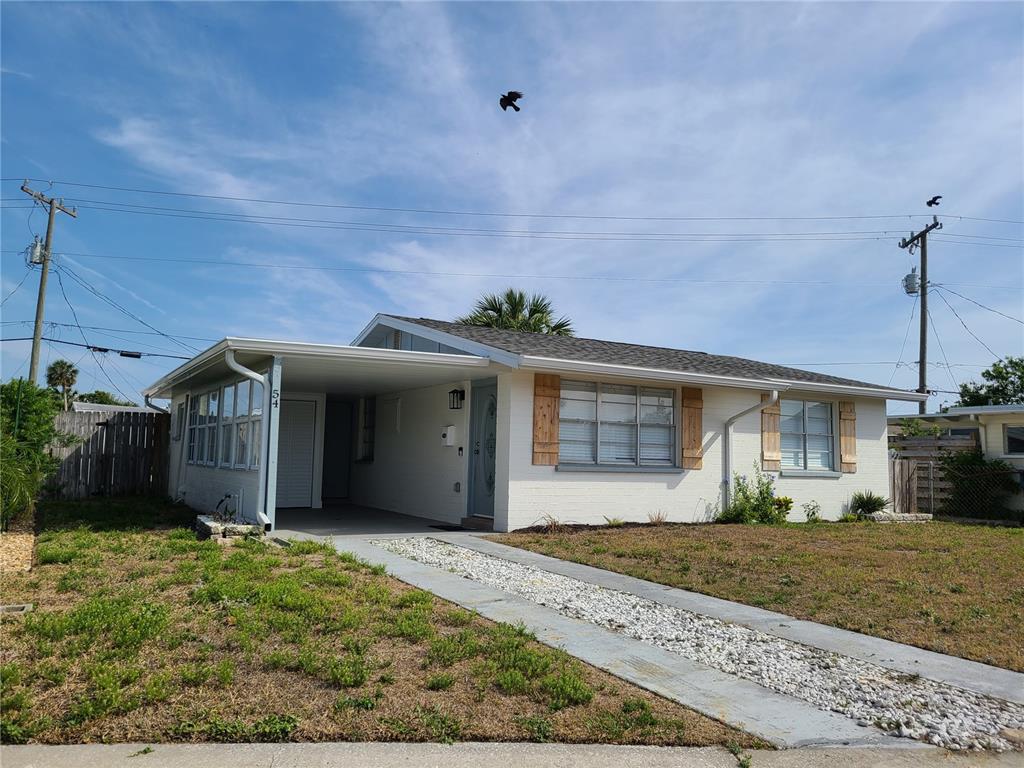 54 Rivershore Drive Ormond Beach, FL 32176 - Photo 2 of 38 a view of a house with a yard