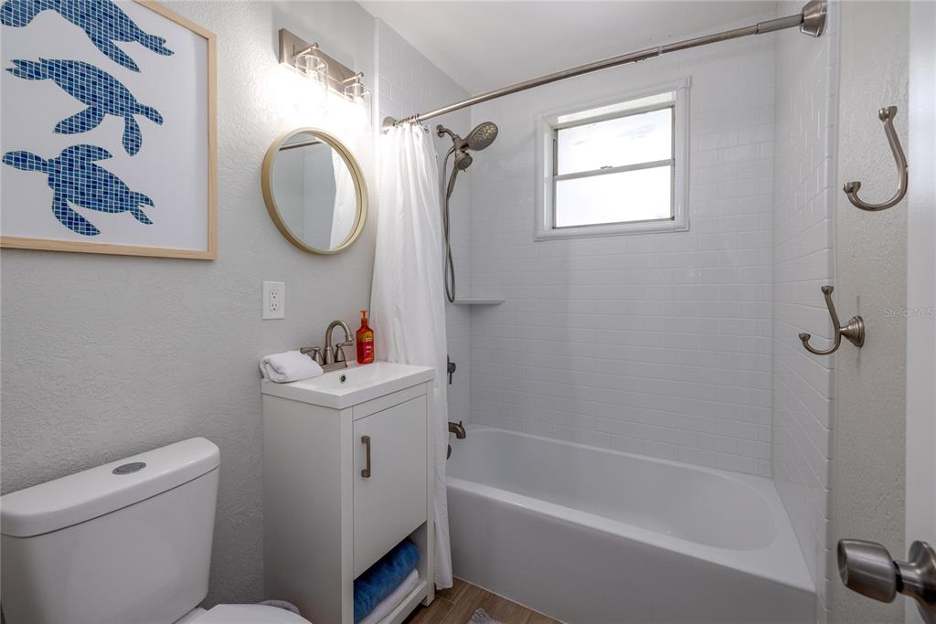 54 Rivershore Drive Ormond Beach, FL 32176 - Photo 21 of 38 a white toilet sitting next to a bath tub shower