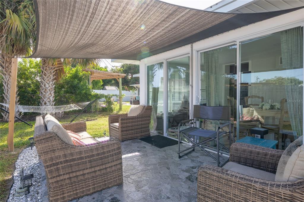 54 Rivershore Drive Ormond Beach, FL 32176 - Photo 24 of 38 a outdoor living space with patio furniture and a potted plant