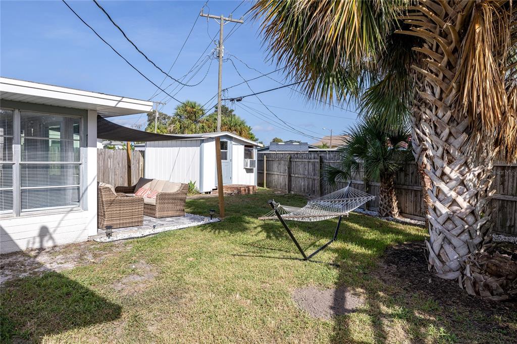54 Rivershore Drive Ormond Beach, FL 32176 - Photo 27 of 38 a view of a house with backyard and sitting area
