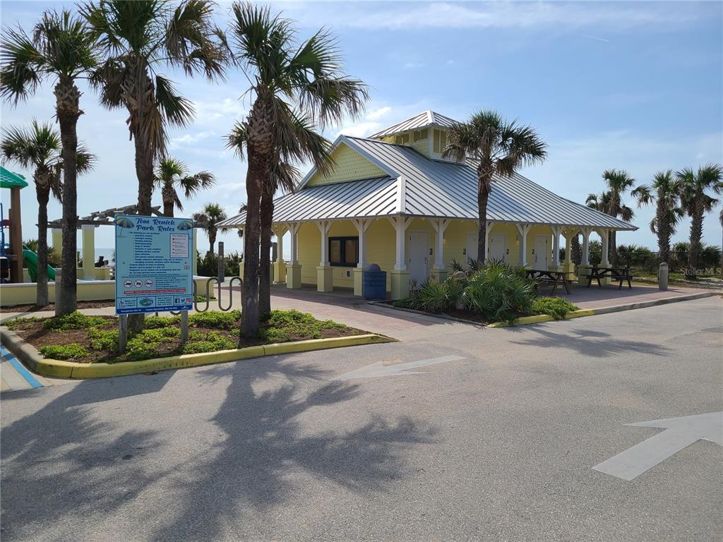 54 Rivershore Drive Ormond Beach, FL 32176 - Photo 29 of 38 a front view of a house with a garden and lake view
